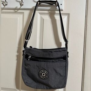 Kipling Gray Crossbody Bag with Striped Strap